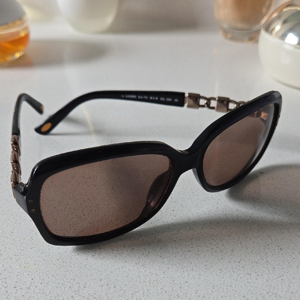 Loewe Elegant Black and Gold Sunglasses